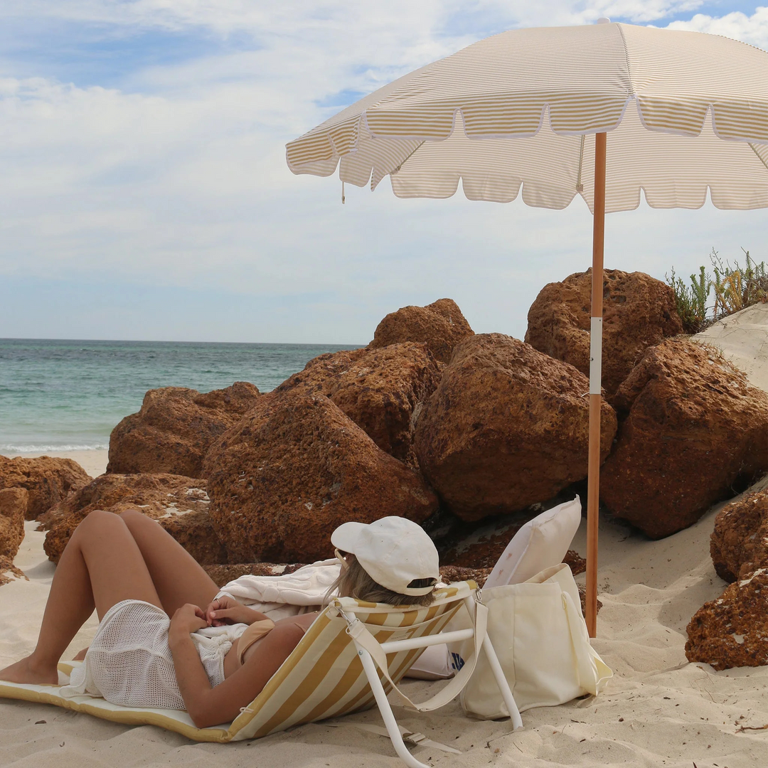 Sunnylife Reclining Beach Chair Mango Bay Golden Mustard Stripe Lifestyle | Merchants Homewares