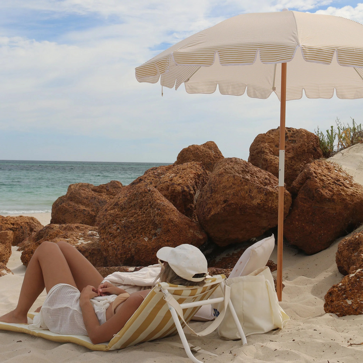 Sunnylife Reclining Beach Chair Mango Bay Golden Mustard Stripe Lifestyle | Merchants Homewares
