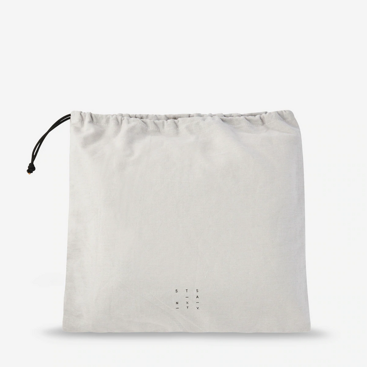 Status Anxiety Art of Pretending Bag Tan Drawstring Bag | Merchants Homewares